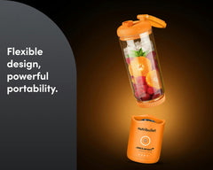 The blender cup lifts off the base to show its flexible, cordless design and portability.