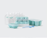 Empty NutriBullet Baby pouches, spoons, freezer cups and storage cups on white background.