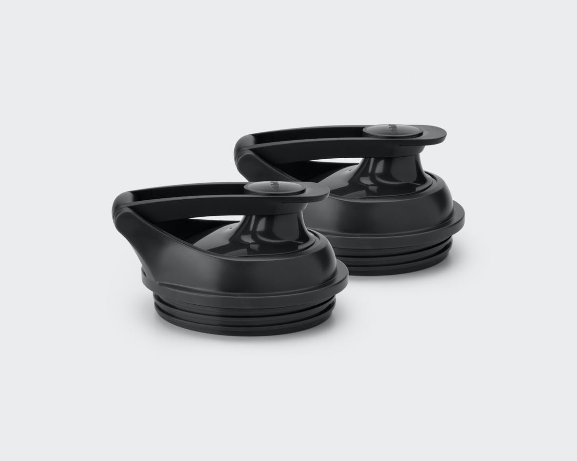 NutriBullet Smart Touch Blender set of two to-go lids on gray background.