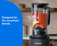 The nutribullet Power Core Blender shown on a kitchen countertop with a woman's hands pressing the Power button.