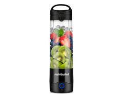 the nutribullet Portable Blender, filled with fruit, stands alone on a white background.