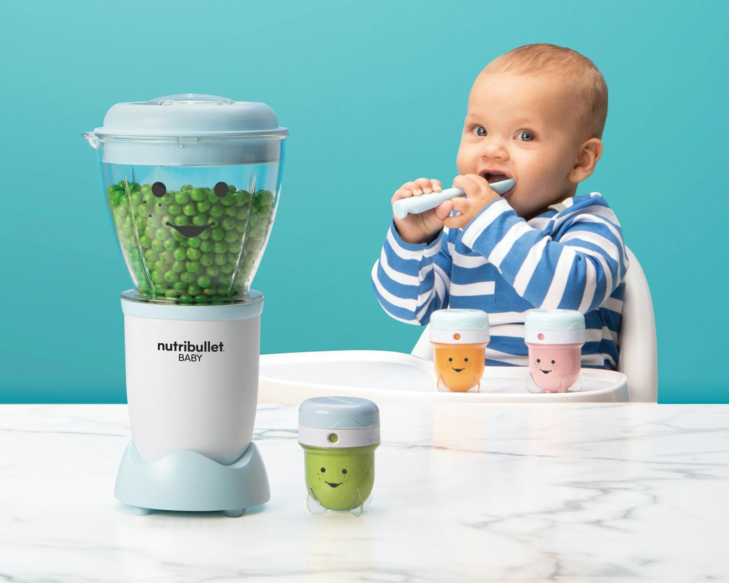 NutriBullet Baby with storage cups on blue background.