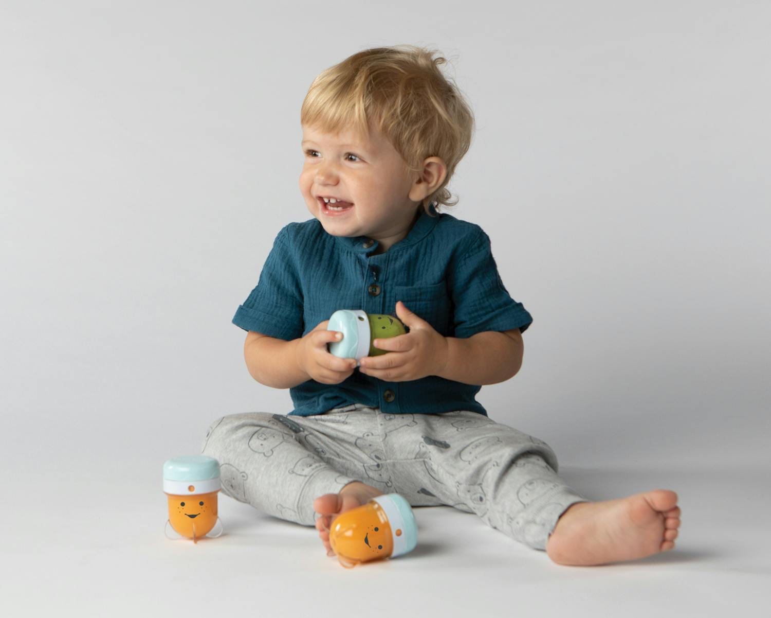 Child with NutriBullet Baby storage cups.