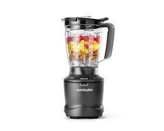 Image of the fully-assembled SmartSense Blender set on a white background. The blender pitcher is filled with colorful fruits.