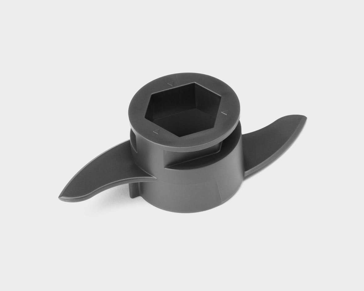 Close up on the Food Processor Dough Blade on a white background.
