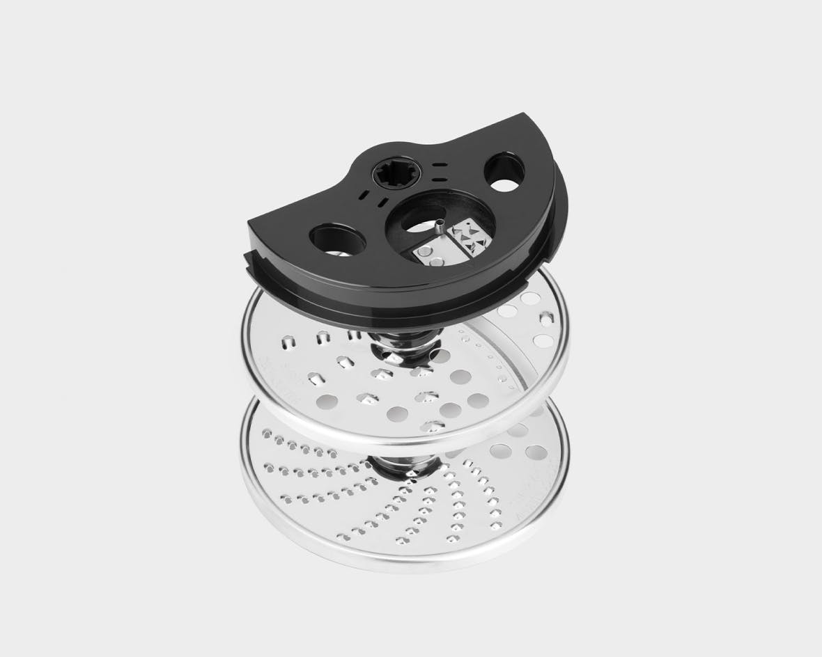 Close up on the Food Processor shredding disc kit on a white background.