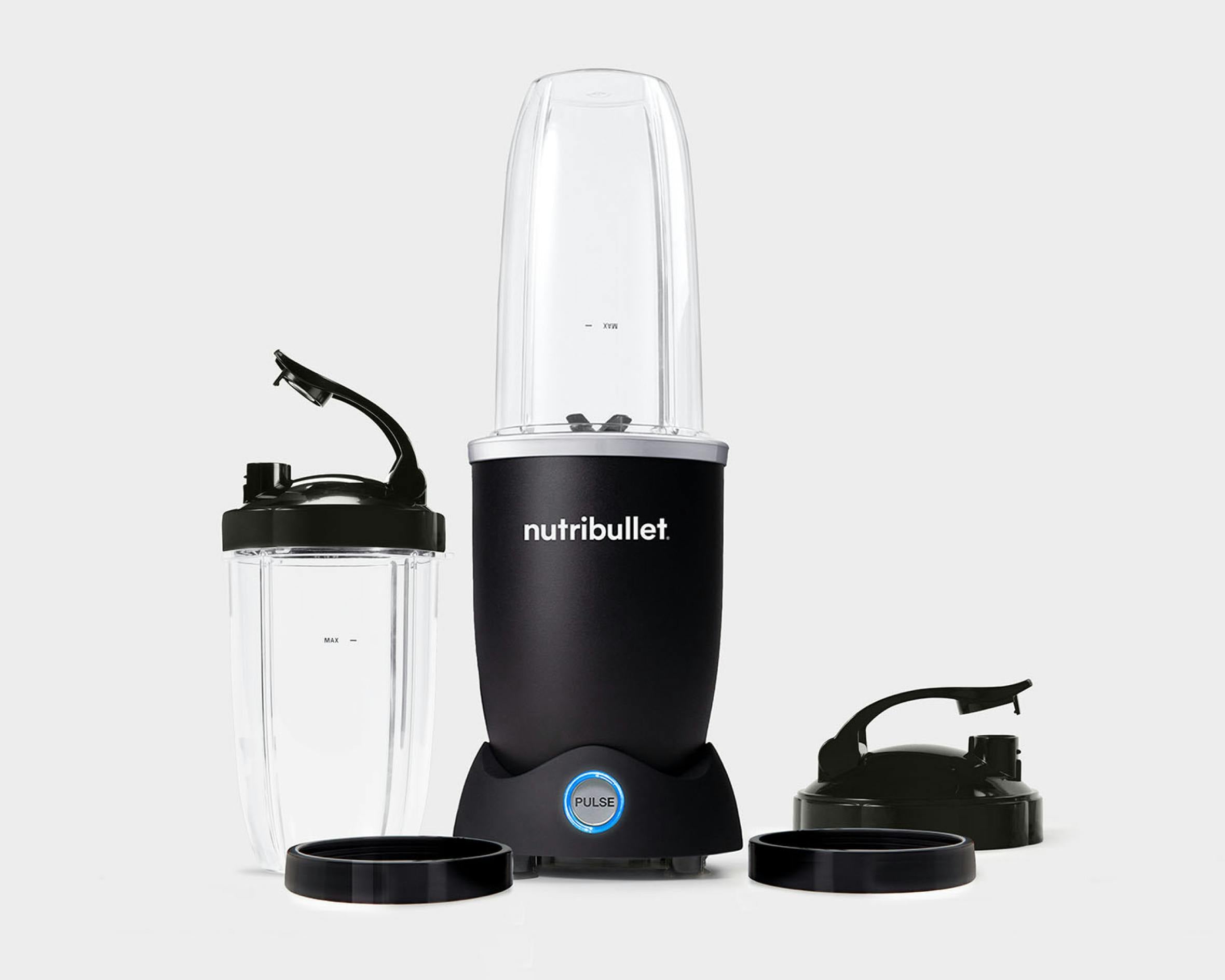 empty matte black nutribullet pro plus with cups and lid on a grey background