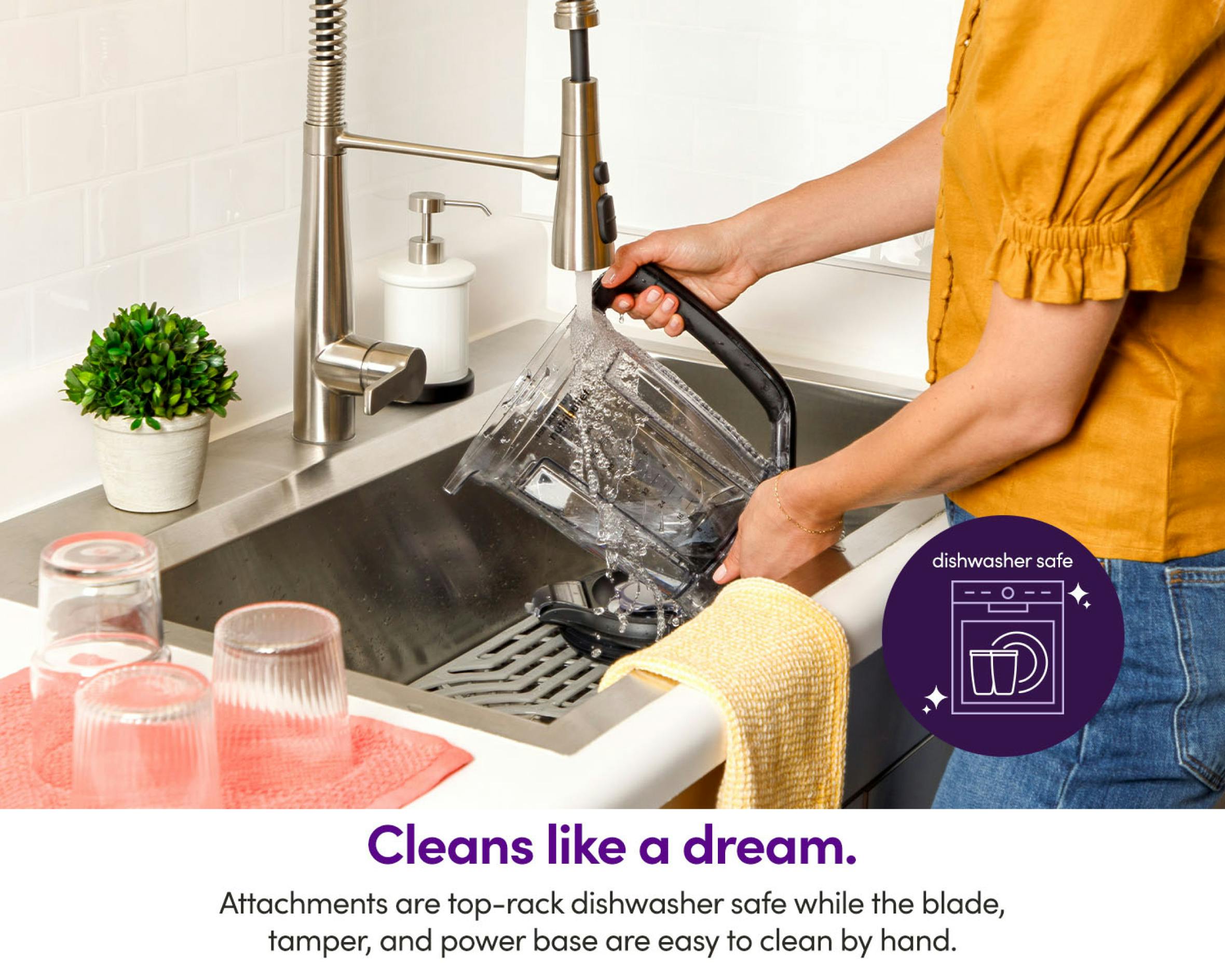 Woman holding the nutribullet Triple Prep large pitchet while washing it on the sink