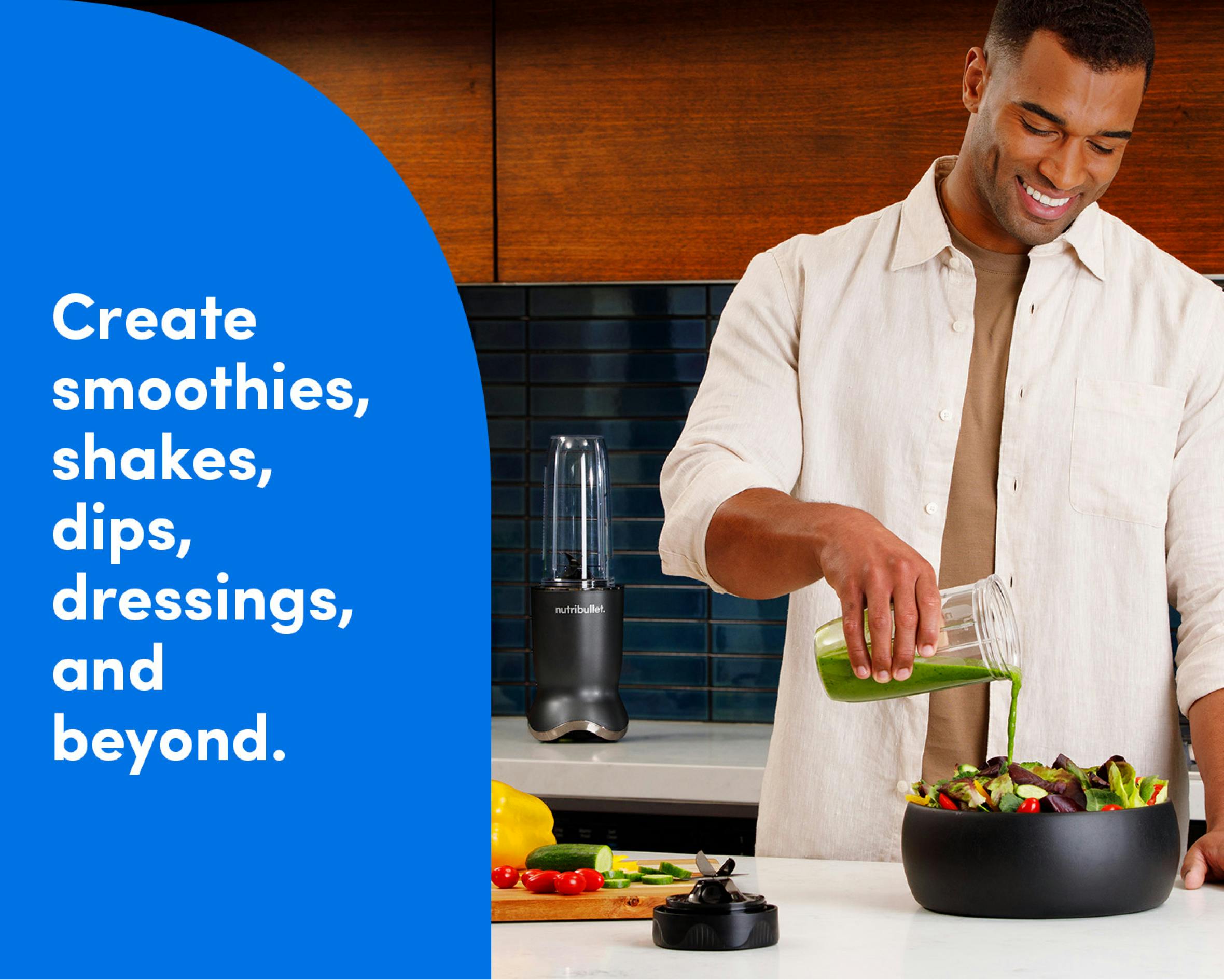 A man stands behind a kitchen island and pours green salad dressing from his nutribullet Ultra cup over a bowl full of lettuce and other vegetables. The nutribullet Ultra is seen on the countertop behind the man to his left. Tex reads: create smoothies, shakes, dips, dressings, and beyond.