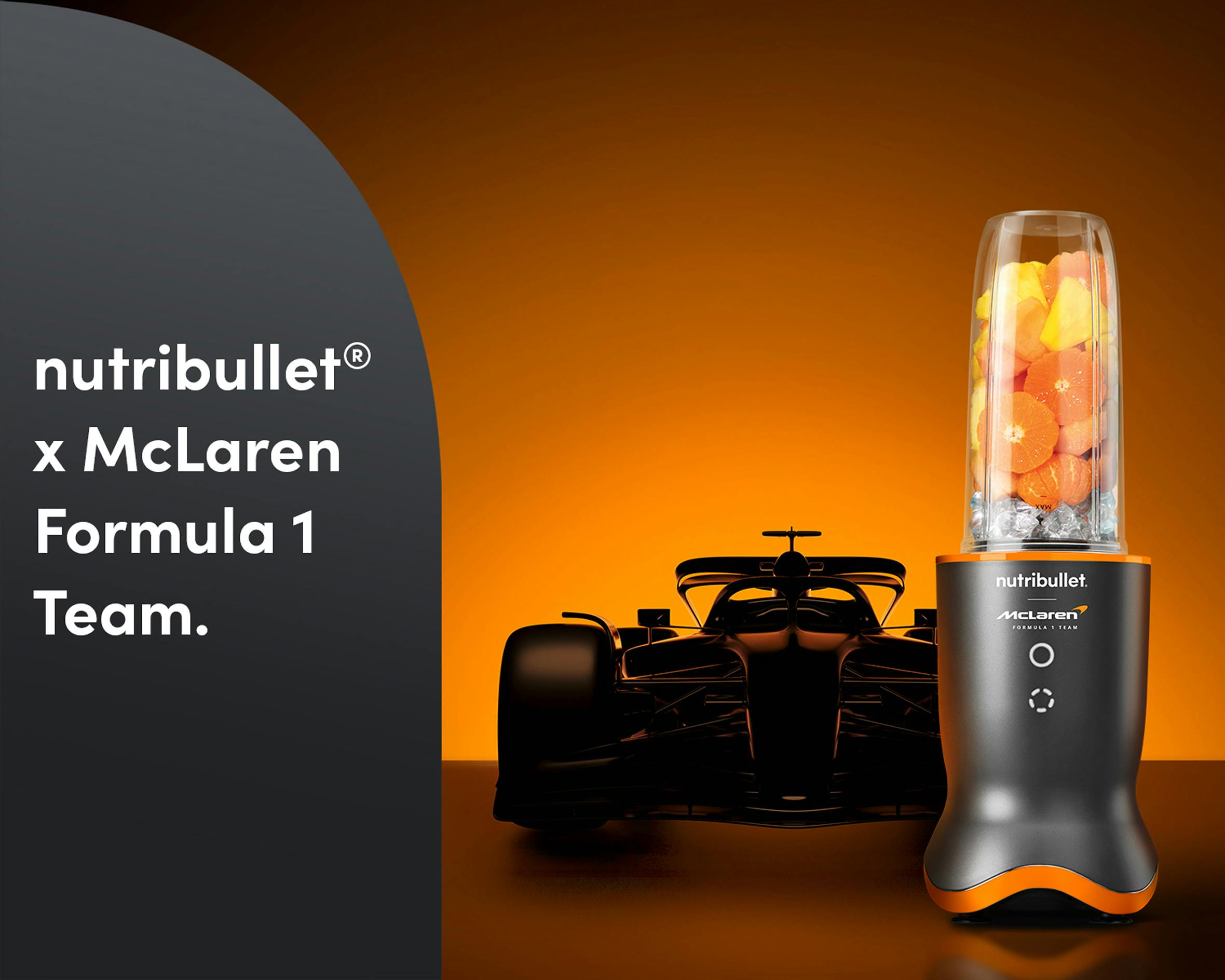 The nutribullet® x McLaren: Ultra with fruit and ice with a Formula 1 car in the back. A panel on the left reads "nutribullet® x McLaren Formula 1 Team".