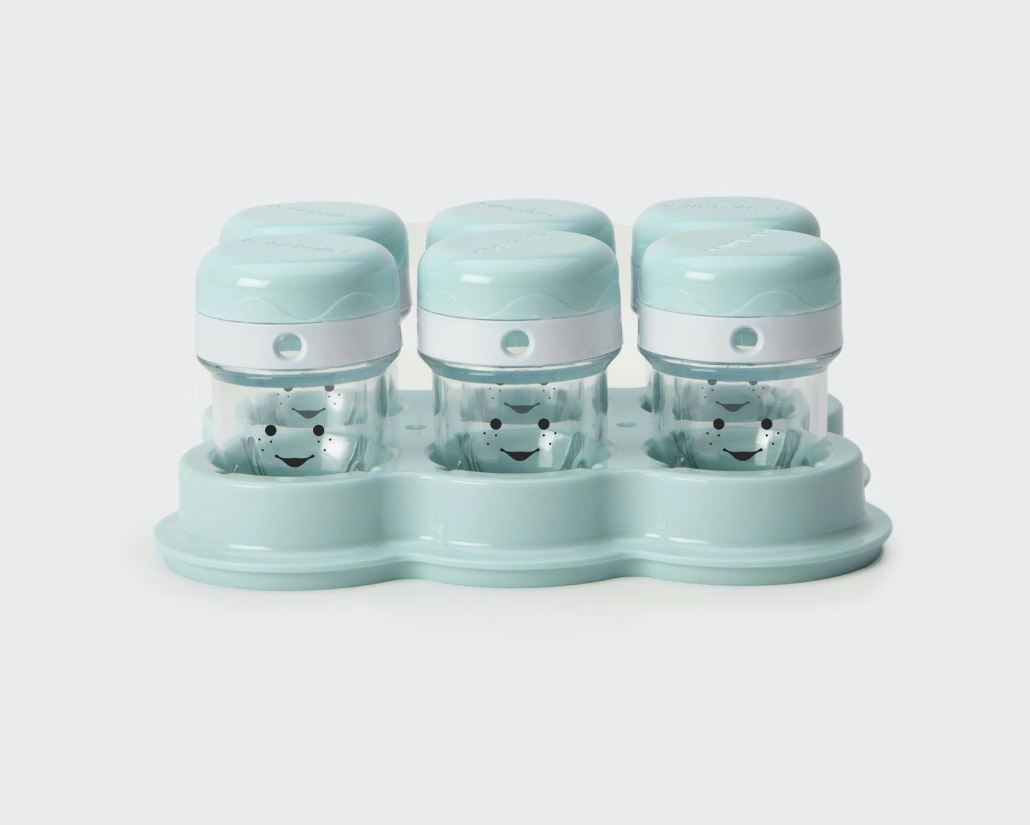 Set of six blue and clear NutriBullet Baby storage cups and lids with smiley faces on cups.