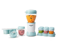 nutribullet Baby with carrots on white background.