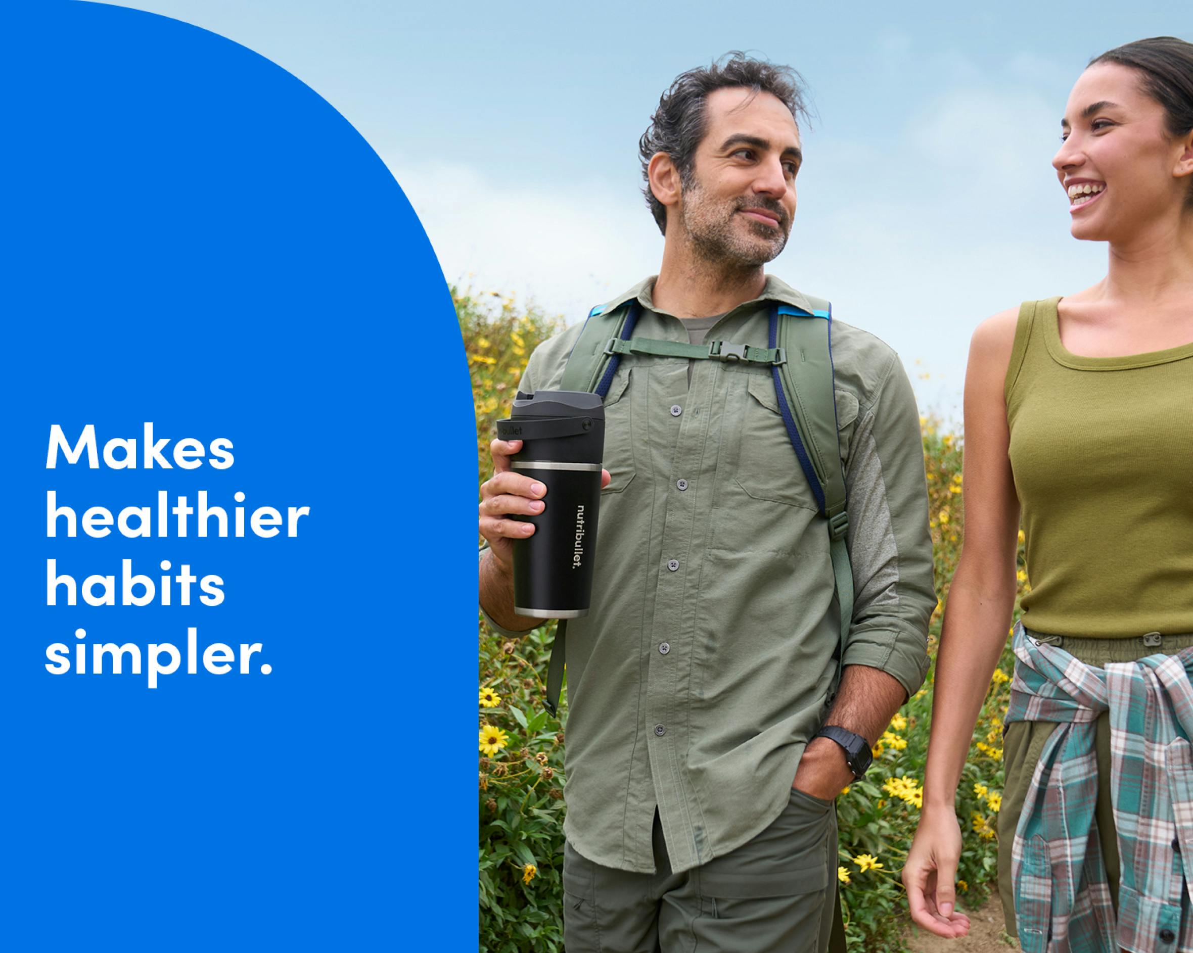 Man and woman walking while men is holding a nutribullet Flip Insulated Portable Blender. Makes healthier habits simpler.