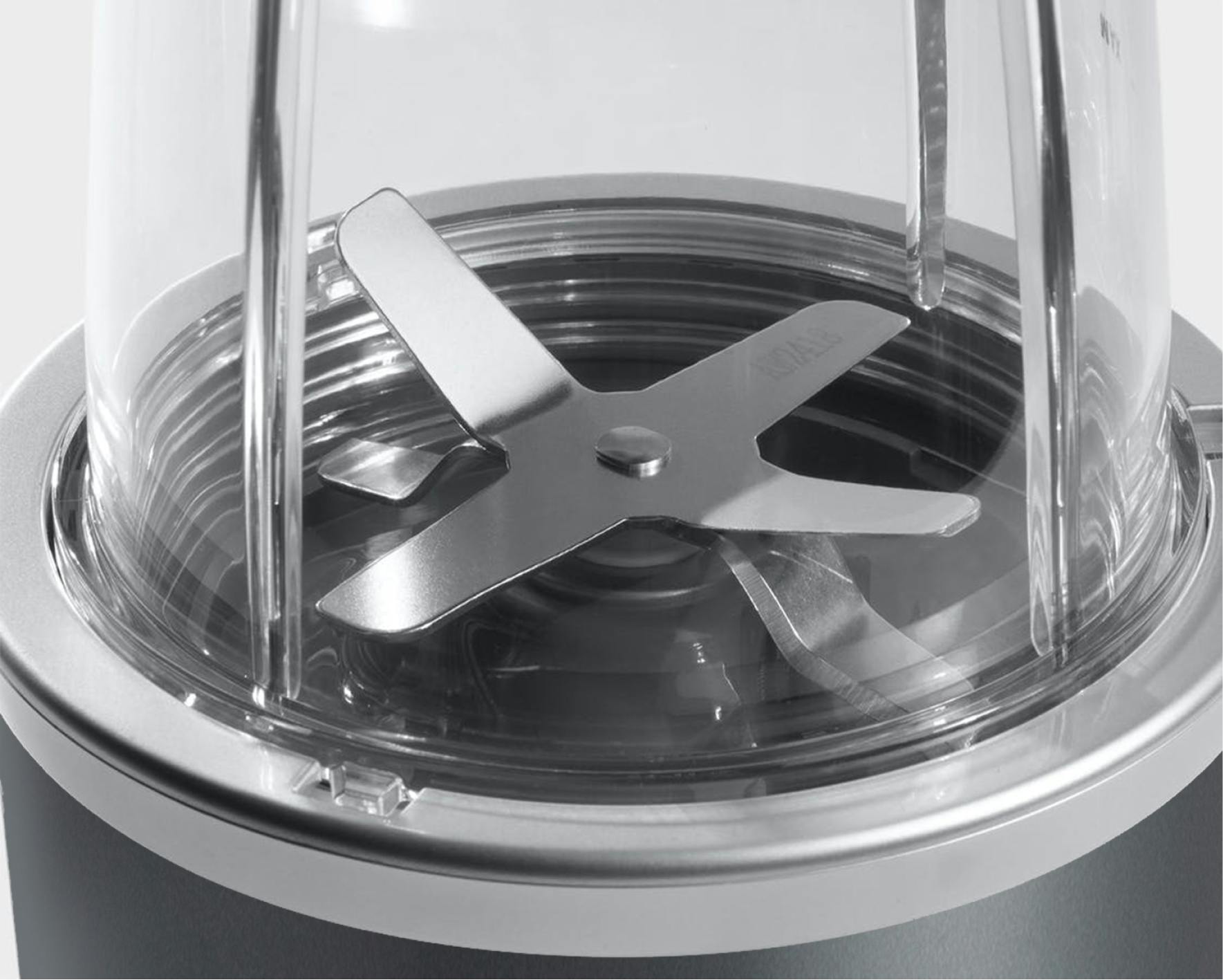 NutriBullet original extractor blade closeup on grey background.
