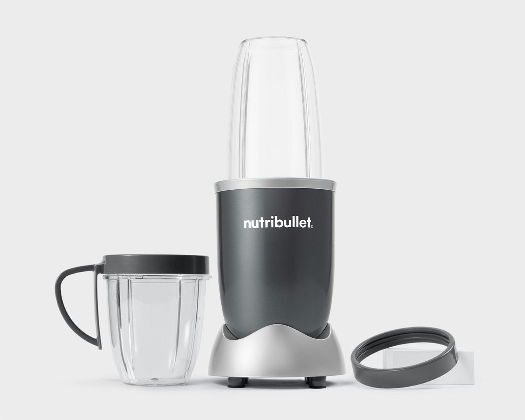 NutriBullet original with cup and comfort lip ring on grey background.