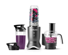 The nutribullet Ultra Plus set with a sleek metallic base, a blending cup filled with fruits and ice, a travel cup with a lid, a food processor bowl, all arranged on a white background.